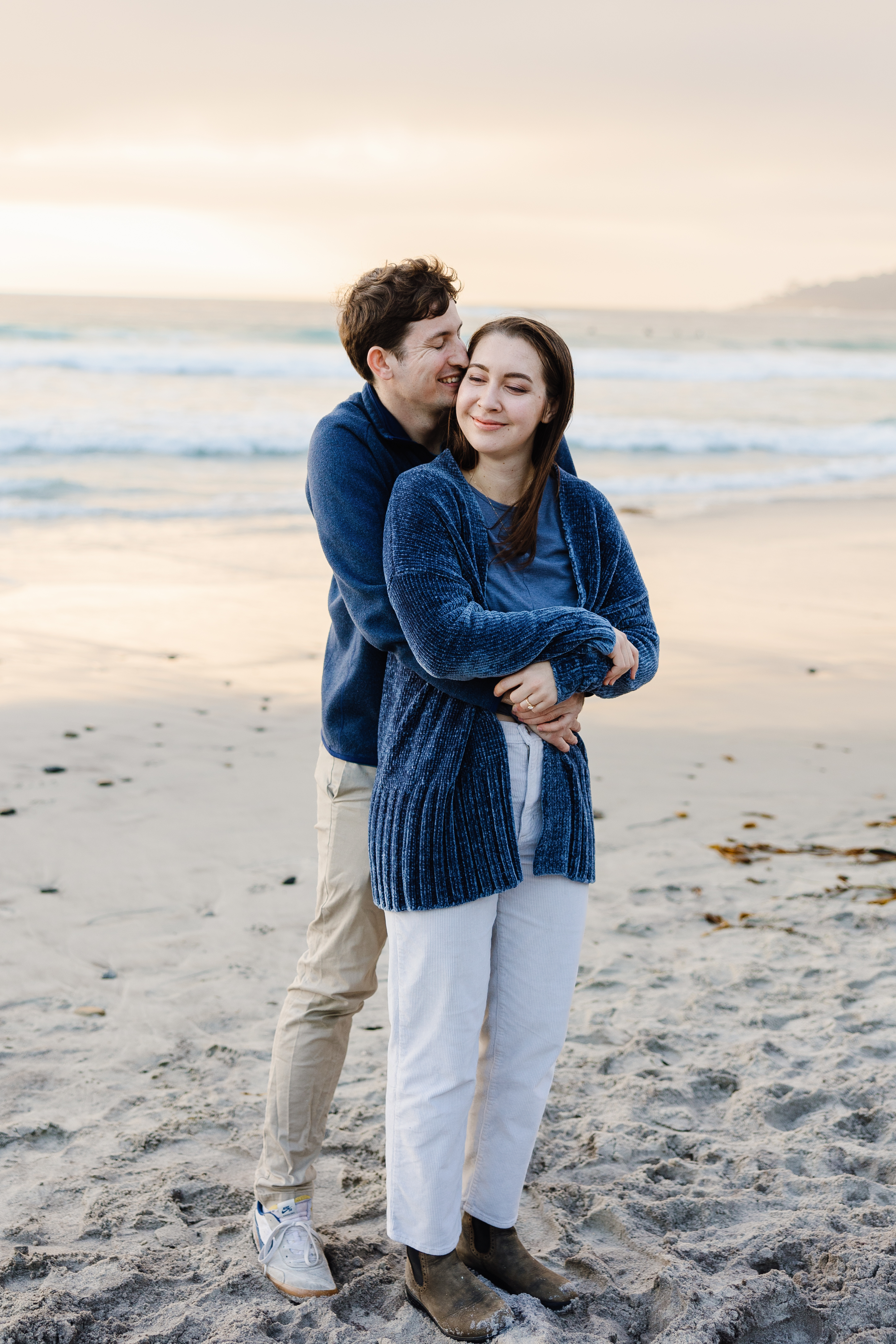 Jenna and Liam full-length embrace on beach